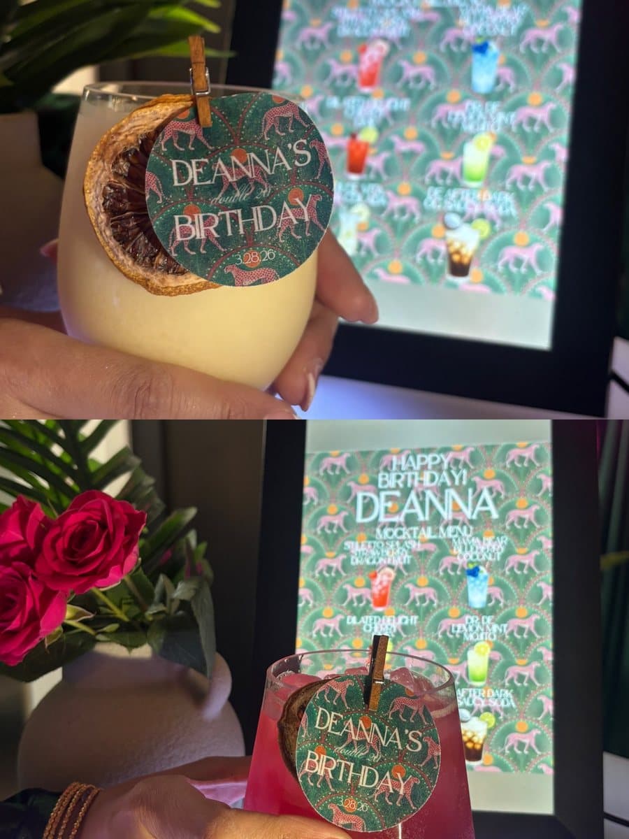 Custom birthday drink tags on Abu Sauce mocktails beside a printed party menu